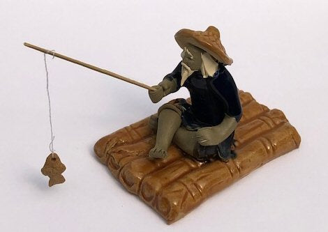 Miniature Ceramic Figurine-Glazed Fisherman Sitting On Raft-2.75