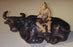 Ceramic Figure-Man Sitting On Sitting Buffalo-Large