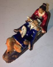 Ceramic Figurine-Man & Woman Relaxing On A Bench