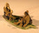 Miniature Ceramic Figurine -Two Mud Men On A Leaf, One Sitting Smoking a pipe, The Other Sitting - 2