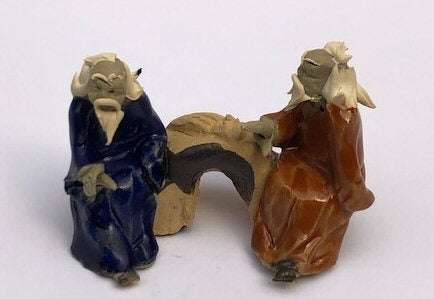 Ceramic Figurine-Two Men Sitting On A Bench - 2-Playing Musical Instrument-Color: Blue & Orange