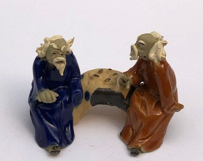Ceramic Figurine-Two Men Sitting On A Bench - 2-Playing Chess-Color: Blue & Orange