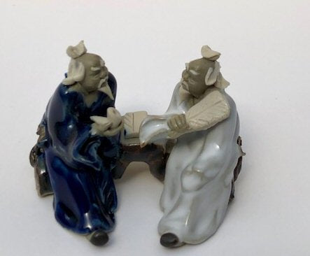 Ceramic Figurine-Two Men Sitting On A Bench Holding Fan & Pipe- 2.25-Color: Blue & White