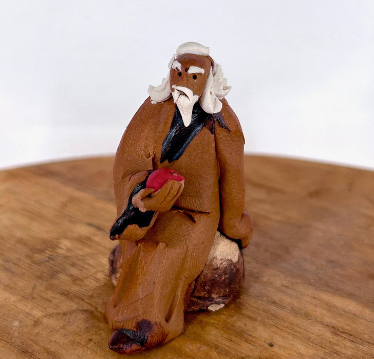 Miniature Ceramic Figurine -Mud Man Holding Fruit - 1.75