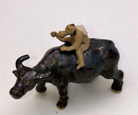 Ceramic Figure-Man Ridding on Buffalo-