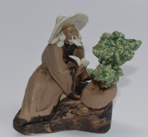 Ceramic Figurine: Mud Man Sitting with Pipe & Bonsai Tree