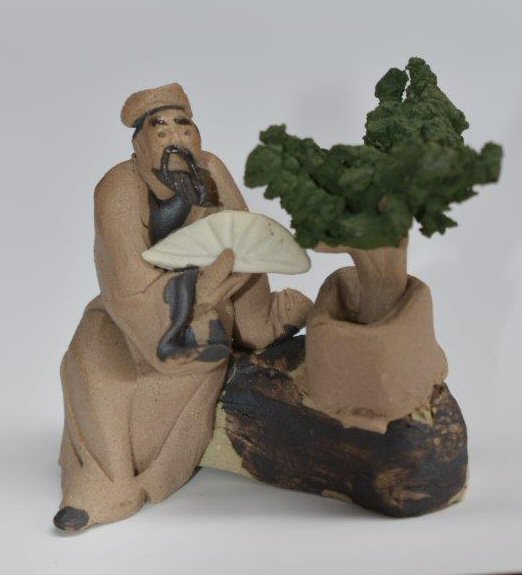 Ceramic Figurine: Mud Man Sitting with Fan & Bonsai Tree