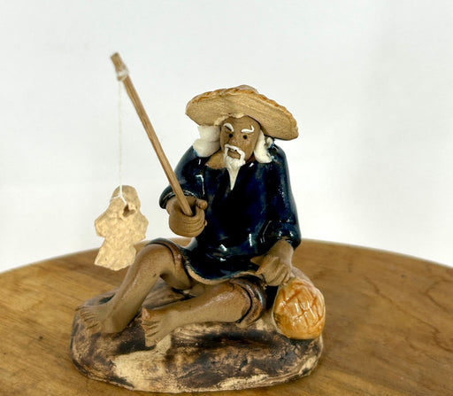 Miniature Ceramic Glazed Fisherman Figurine-Sitting On A Log -Blue - 2.5