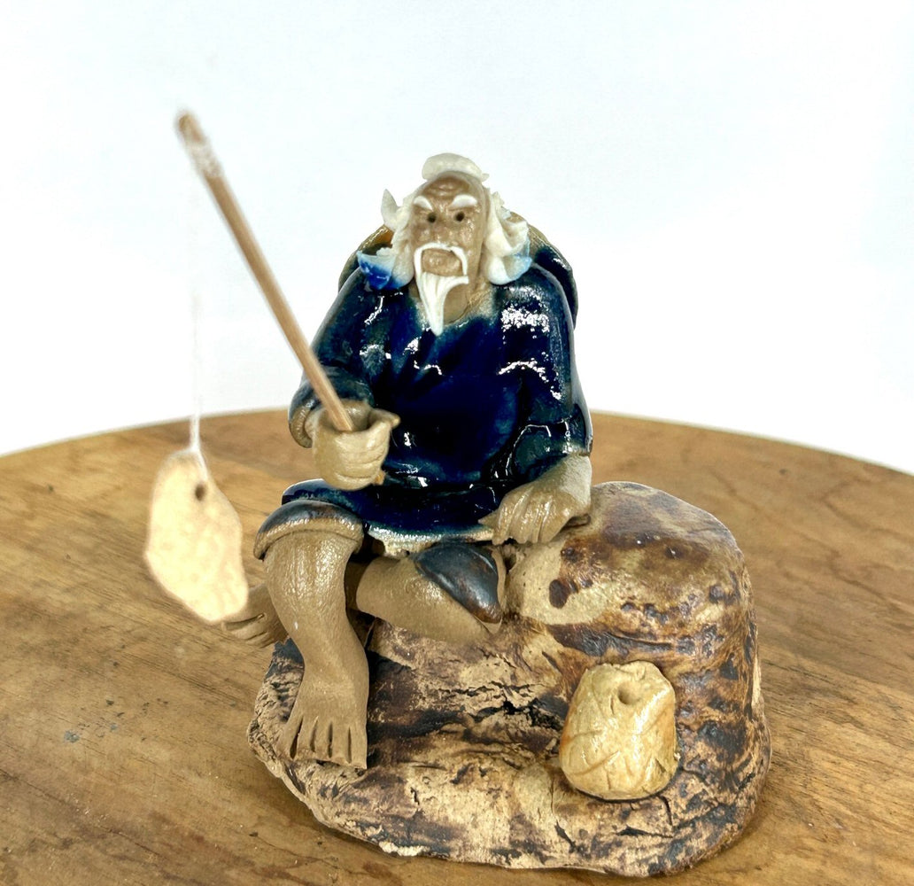 Miniature Ceramic Glazed Fisherman Figurine-Sitting On A Log -Blue - 2.5
