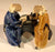 Ceramic Figurine-Two Men Sitting On A Bench Scribing - 2.5-Color: Blue & Light Brown